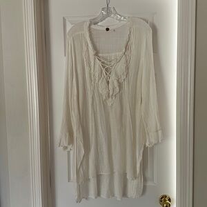 Free people gauze beach coverup or mini dress. Ruffled bell sleeve. Laceup front
